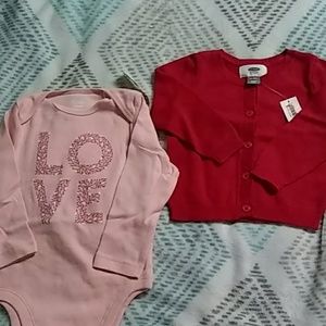 Pink onesie and red sweater
